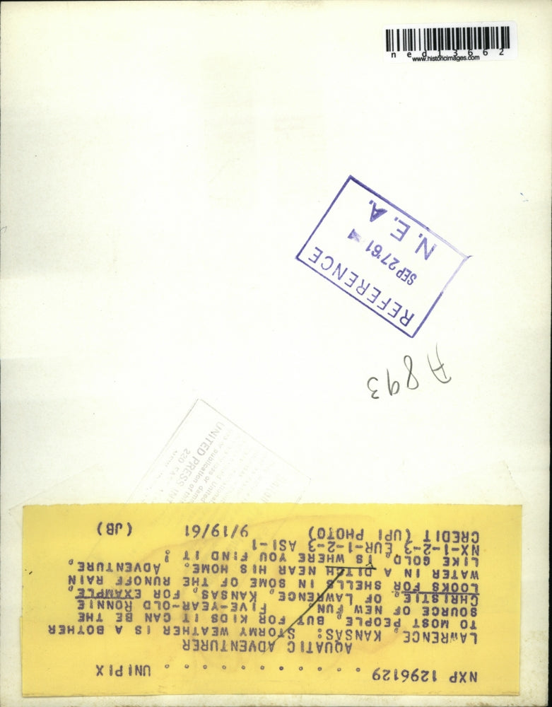 1961 Media Photo 5 Year-Old Ronnie Christie Searches Stream Rain Runoff Ditch