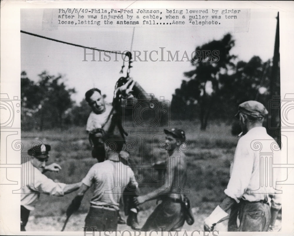 1949 Media Photo Fred Johnson being lowered by girder after he was injured