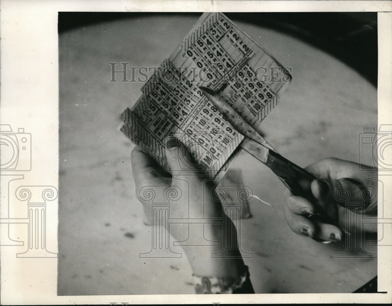 Load image into Gallery viewer, 1945 Media Photo Madame Georgette clips coupons from the official ration bank
