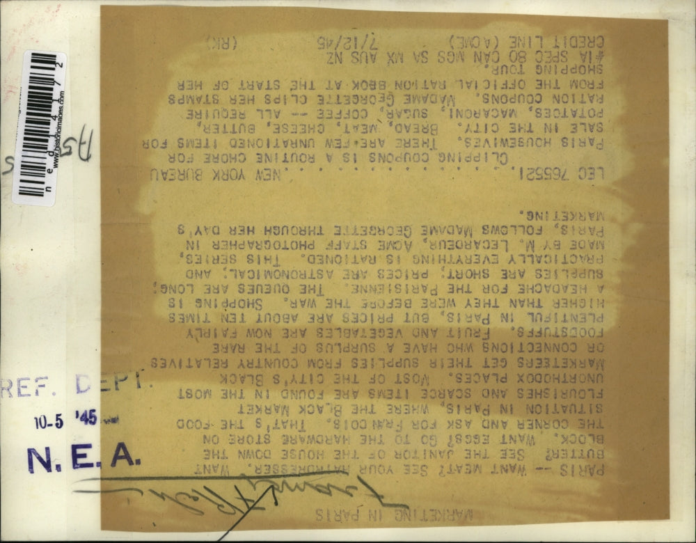 1945 Media Photo Madame Georgette clips coupons from the official ration bank