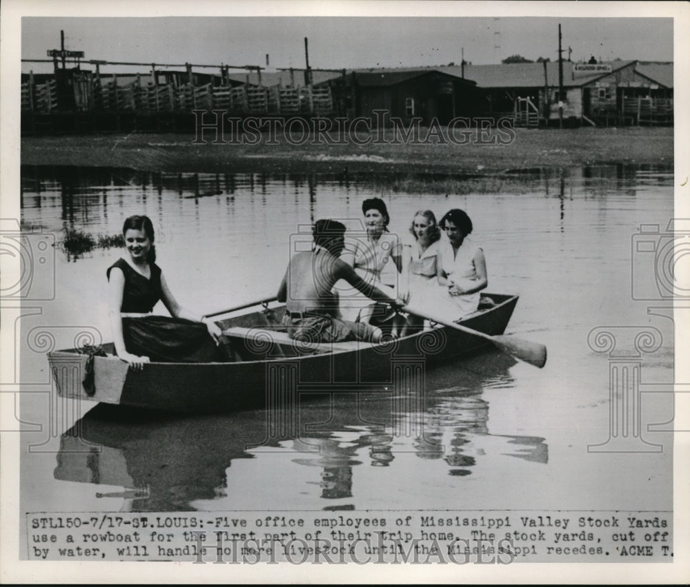 1951 Press Photo Employees of Mississippi Valley Stock Yards use a rowboat