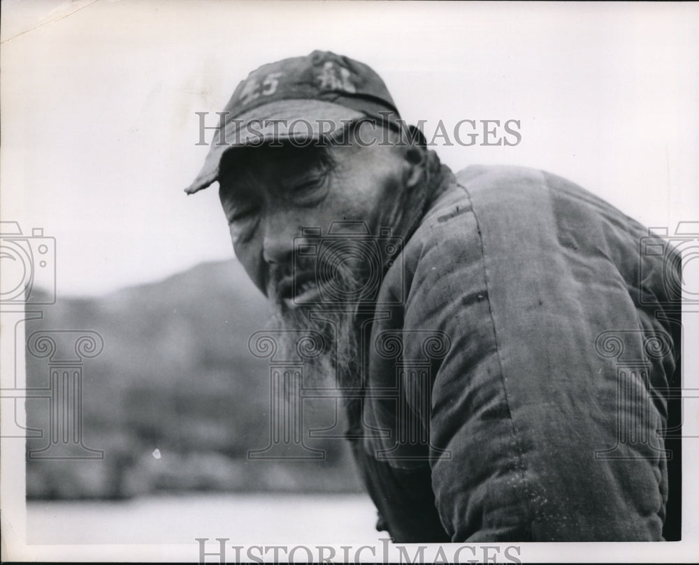 1954 Media Photo Chinese fisherman on hos boat at shoreline
