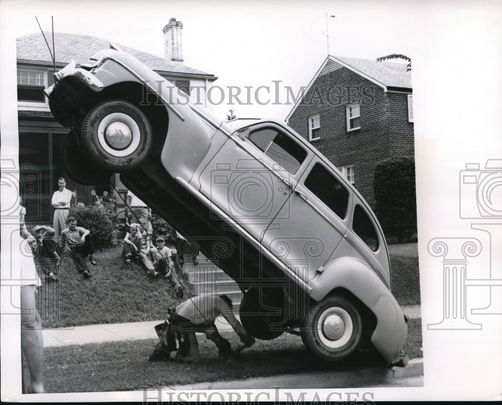 1951 Media PhotoWashington, DC Car balanced on guy wire.