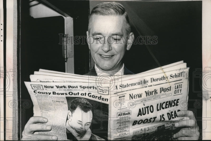 Load image into Gallery viewer, 1963 Media Photo Bertman Powers grins as he reads the copy of New York post
