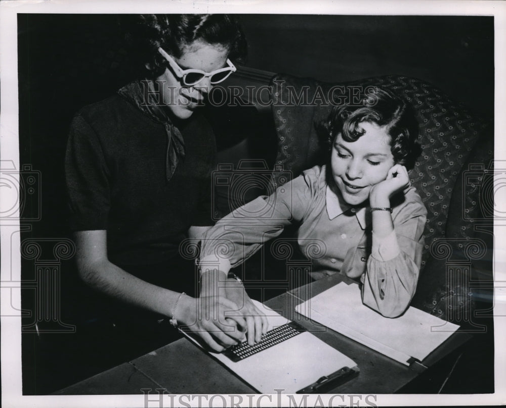 1955 Media Photo Peyton Abbitt, blind, teaches her sister to write in Braille