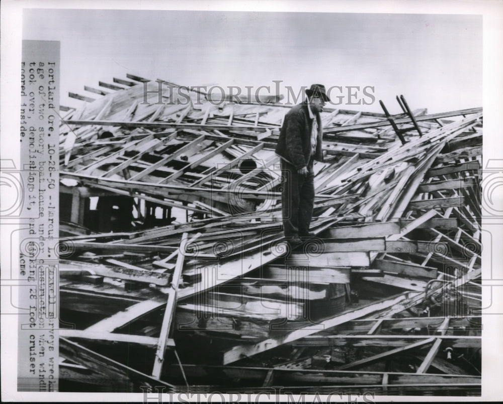 1950 Media Photo Marcus Maxwell surveys the wreckage of a two story boat house.
