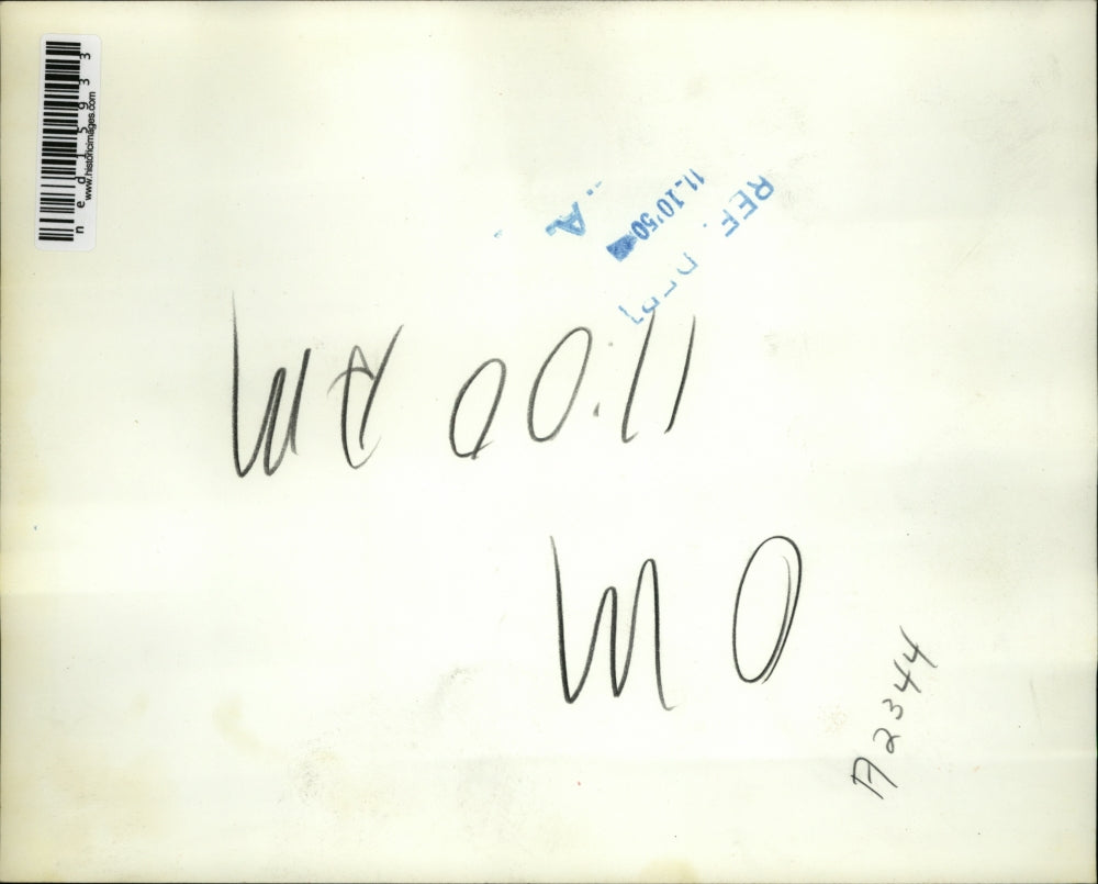 1950 Media Photo Marcus Maxwell surveys the wreckage of a two story boat house.