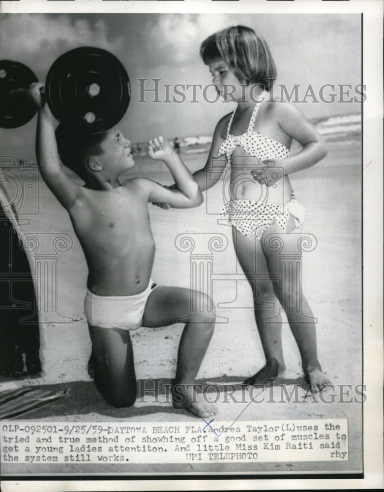 1959 Media Photo Andrea Taylor Shows Off His Muscles To Miss Kim Raiti
