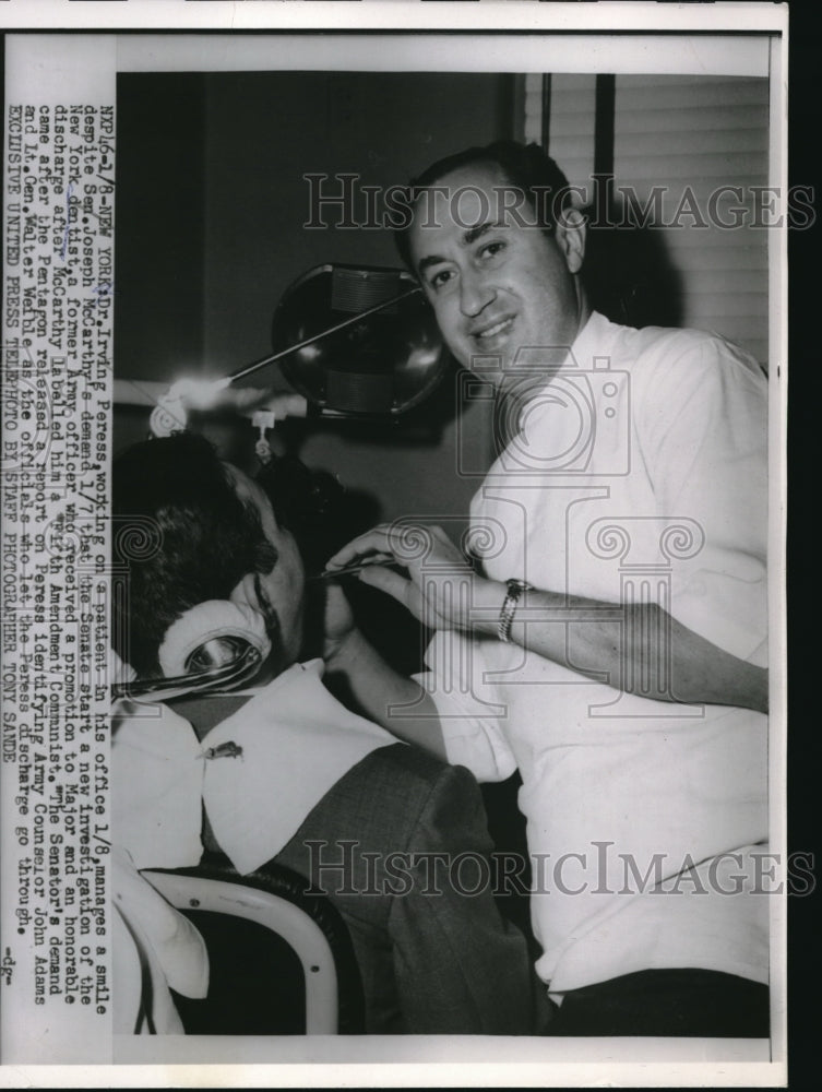 1955 Press Photo New York Irving Peress working on patient