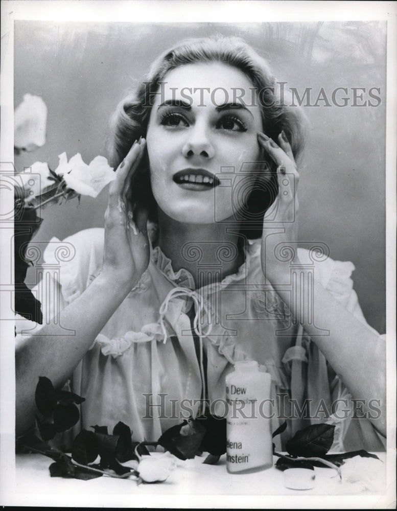 1956 Press Photo New pink liquid cream is designed to keep skin moist.