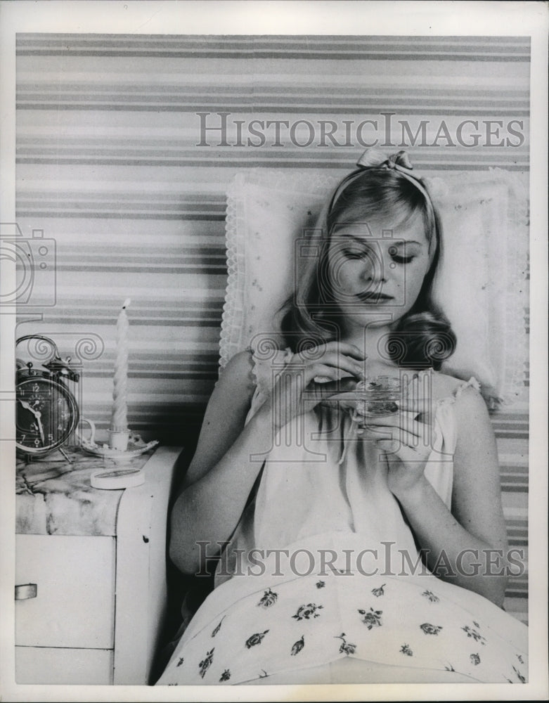 1959 Press Photo A teen ager with skin trouble & acne medicine