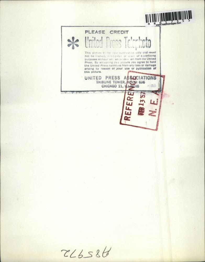 1957 Press Photo George Looks Puzzled After Receiving His Small Award