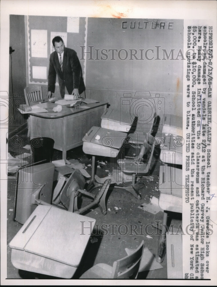 1968 Press Photo Teacher Gowacke looks over classroom damaged by vandals