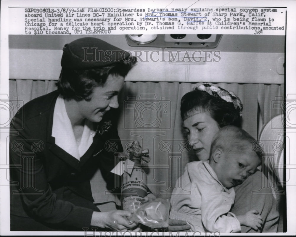 1959 Press Photo San Francisco Stewardess Barbara Healy explains oxygen system