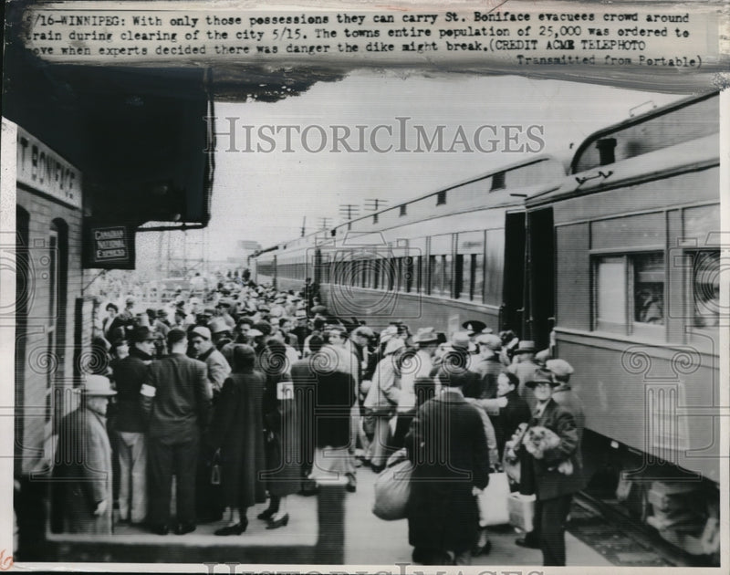 Load image into Gallery viewer, 1950 Press Photo St. Boniface Evacuees Around Train After Flood

