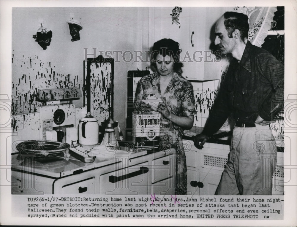 1953 Press Photo Detroit Mr and Mrs John Rishel inspect vandalism