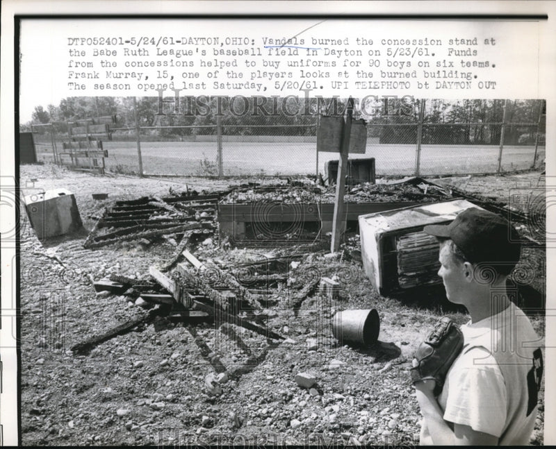 Load image into Gallery viewer, 1961 Press Photo Frank Murray looks at burned concession stand burned by vandals
