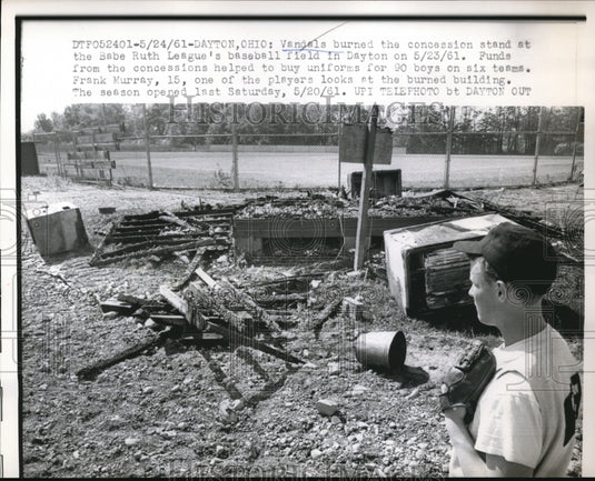 1961 Press Photo Frank Murray looks at burned concession stand burned by vandals