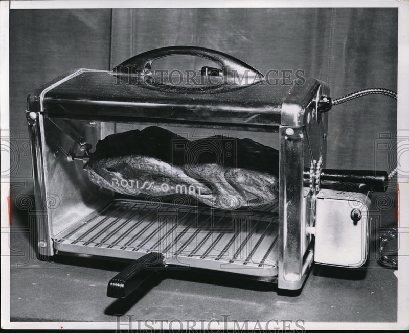 Load image into Gallery viewer, 1953 Press Photo A Rotiss o mat oven demoed in a kitchen
