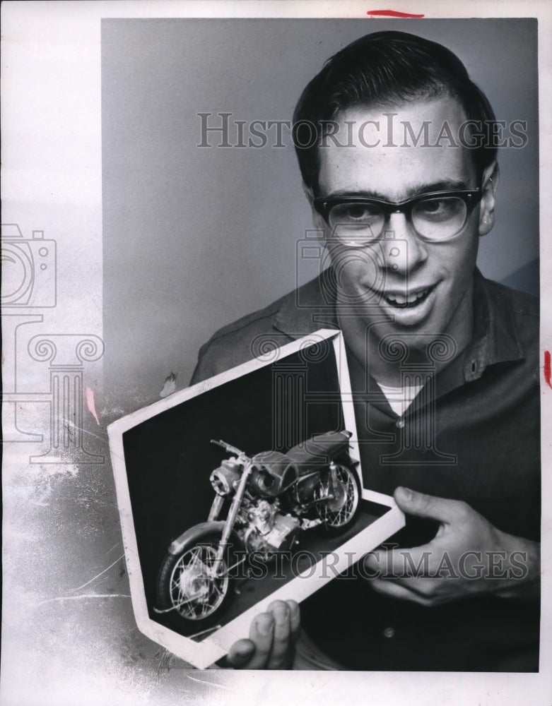 1967 Press Photo Clyde Darasko shows a miniature of motorbike