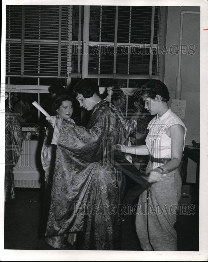 Load image into Gallery viewer, 1956 Press Photo Dody Sterne Adjusts Gilbert &amp; Sullivan Players Sash
