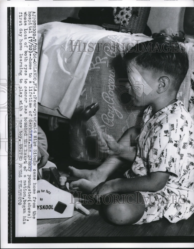 1956 Press Photo Mike Sibole Plays With Toys After Losing Both Eyes To Cancer
