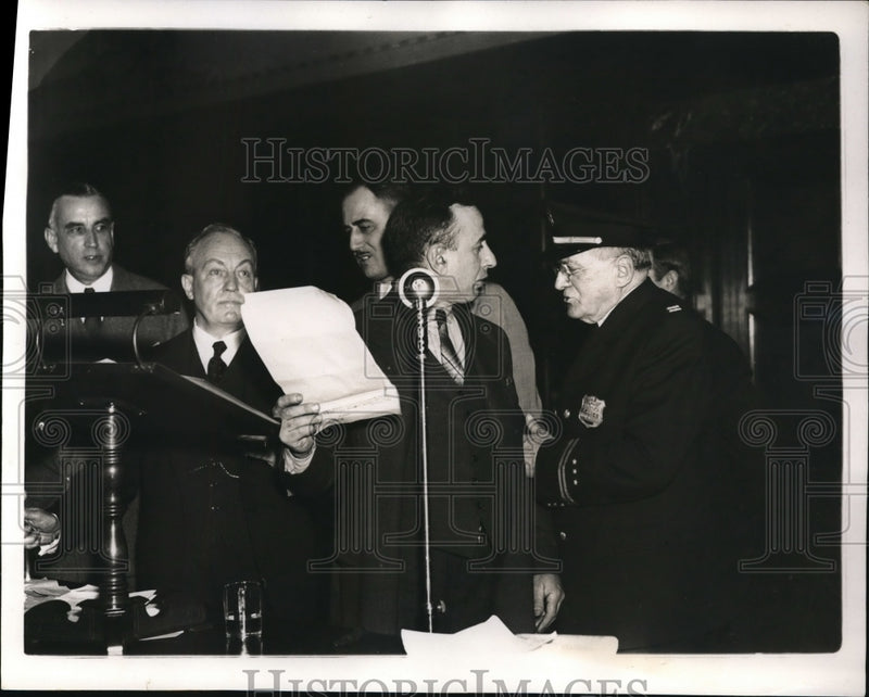 Load image into Gallery viewer, 1938 Press Photo A. S. Shafer being pulled from the microphone after his time.
