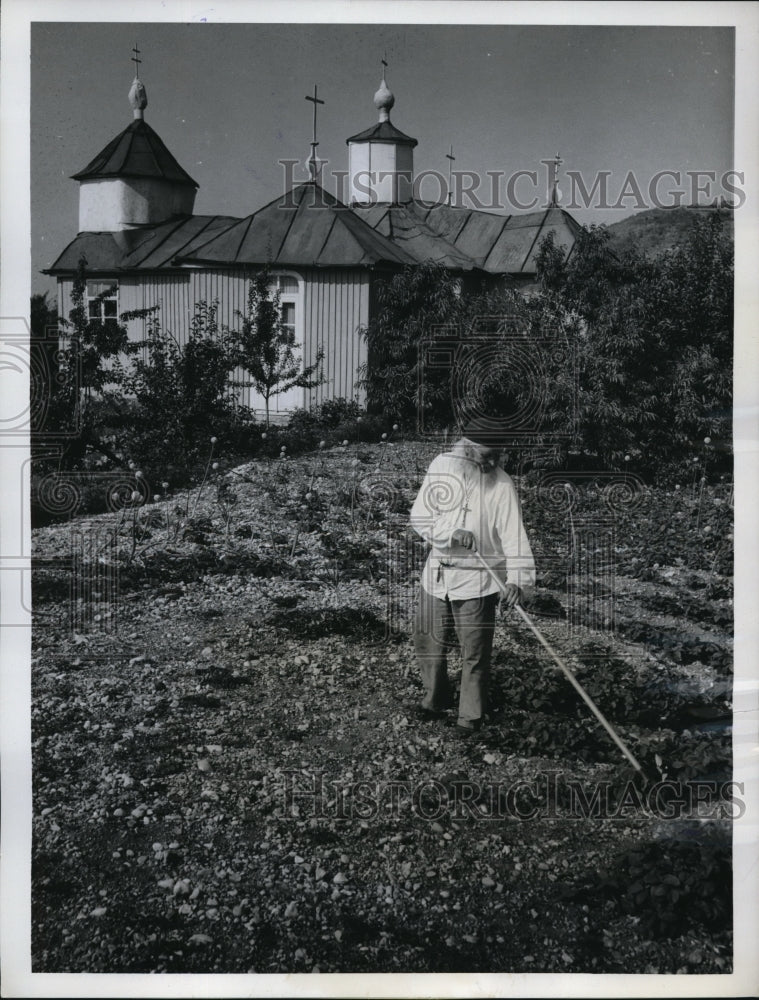 Load image into Gallery viewer, 1962 Press Photo Brother Timofej Prochorov Tends Garden By Self Built Temple
