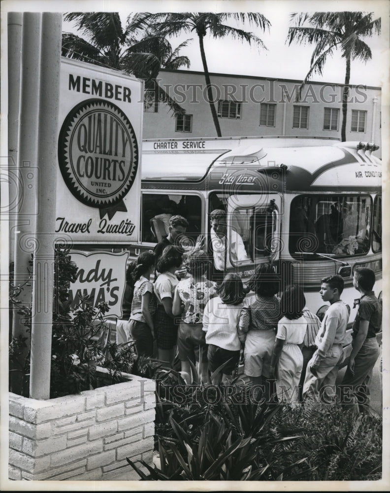 Load image into Gallery viewer, 1960 Press Photo The Goldberg twins use a chartered bus to pick up kids.
