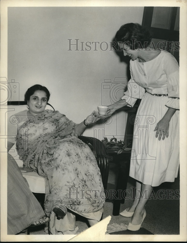 Load image into Gallery viewer, 1961 Press Photo Meg Blood Serves Tea To A Visiting Pakistani Lady
