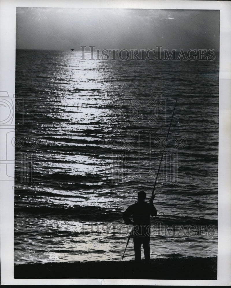 Load image into Gallery viewer, 1962 Press Photo Fisherman Pauses To Gaze At Glittering Sight
