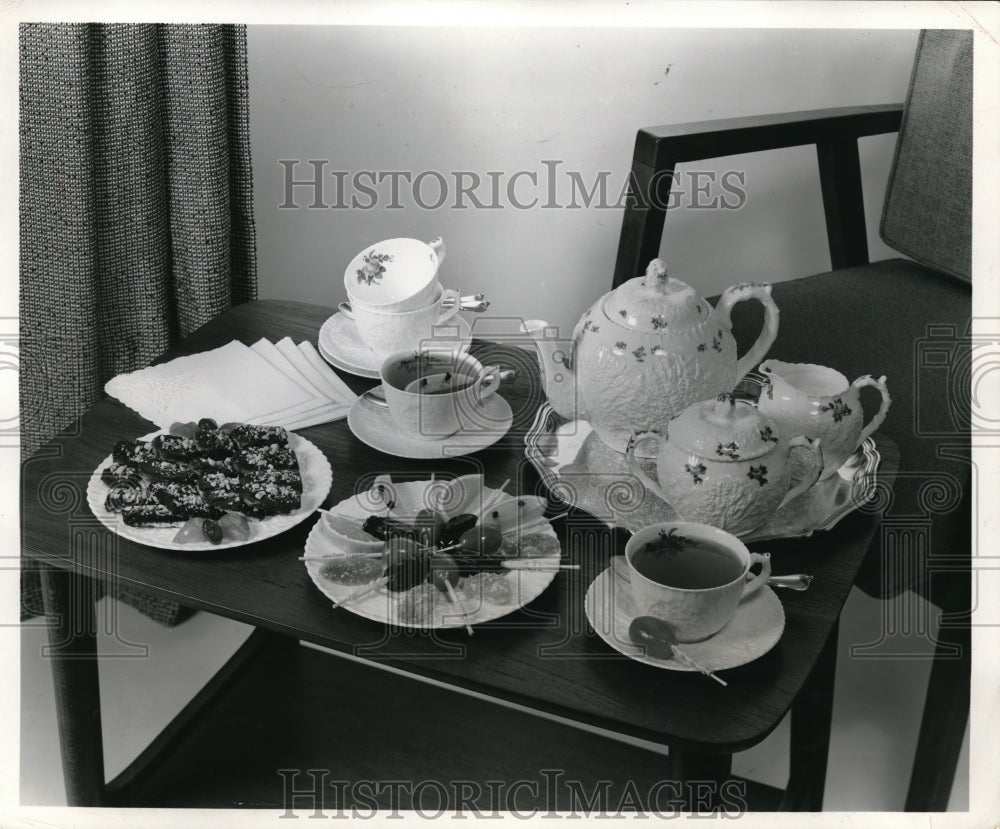 1957 Press Photo A tea service and pastries for guests on atable display