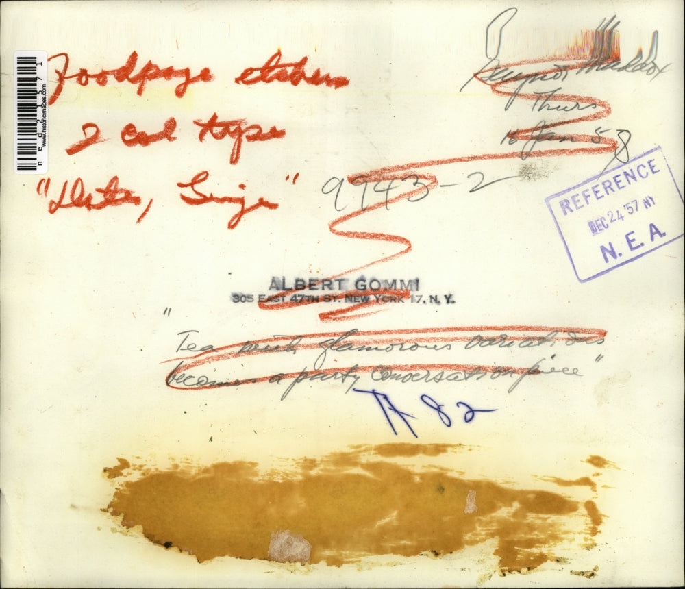 1957 Press Photo A tea service and pastries for guests on atable display