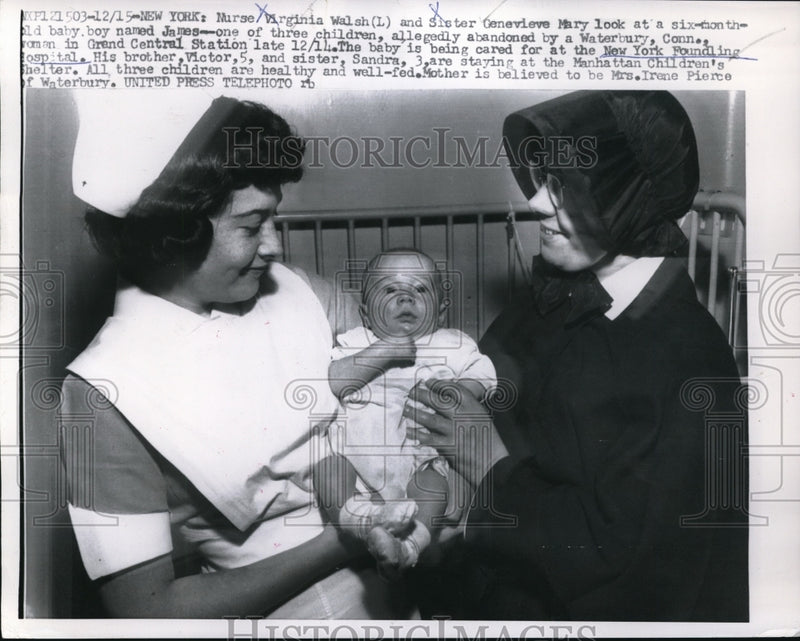 Load image into Gallery viewer, 1956 Press Photo Nurse Virinia Walsh Holding Abandoned Child in Waterbury, CT
