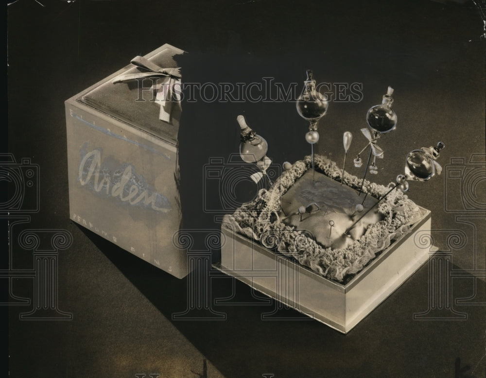 1939 Press Photo Perfume pins in an old fashioned lace pin cushion
