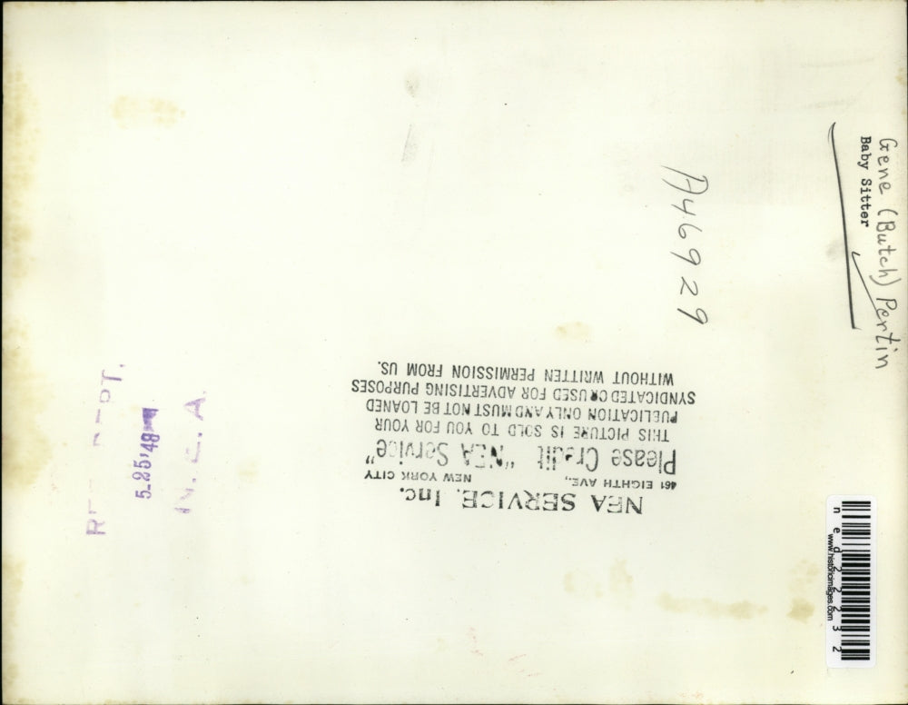 1948 Press Photo Gene Pertine Also Known As Butch Changing A Crying Baby