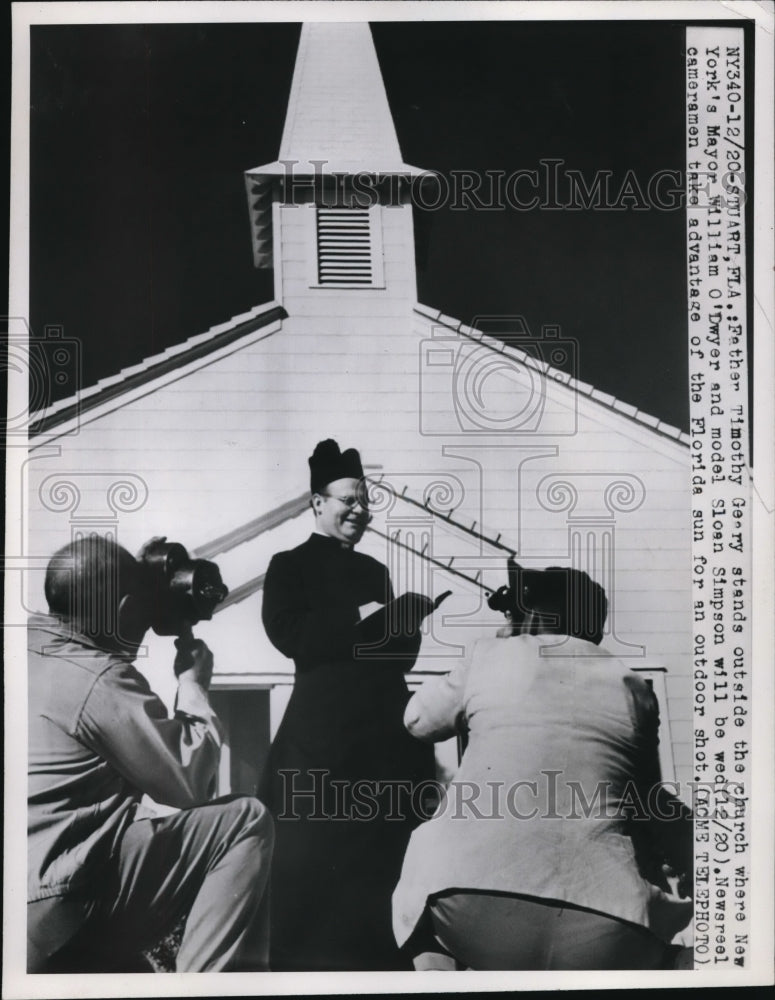 Load image into Gallery viewer, 1949 Press Photo Stuart Fla Father Timothy Geary stands outside church where New
