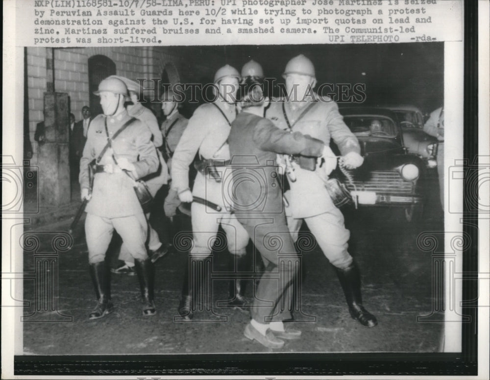 1958 Press Photo Lima Peru Photographer Jose Martinez is seized by Peruvian