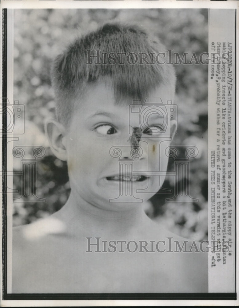 1958 Press Photo Atlanta Ga Clintan S Deney age 9 with grasshopper on his face
