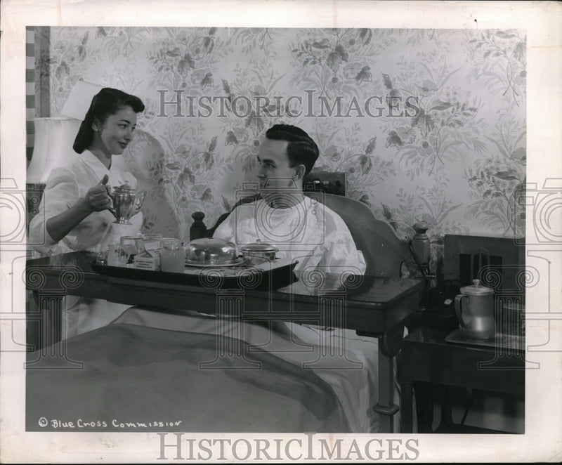 Load image into Gallery viewer, 1954 Press Photo Blue Cross Insurance Plan Care Nurse Serving Patient Meal
