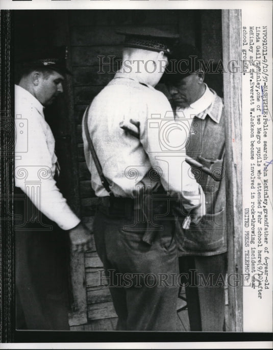 1957 Press Photo Police Search John McKinley After Rock Throwing Incident.