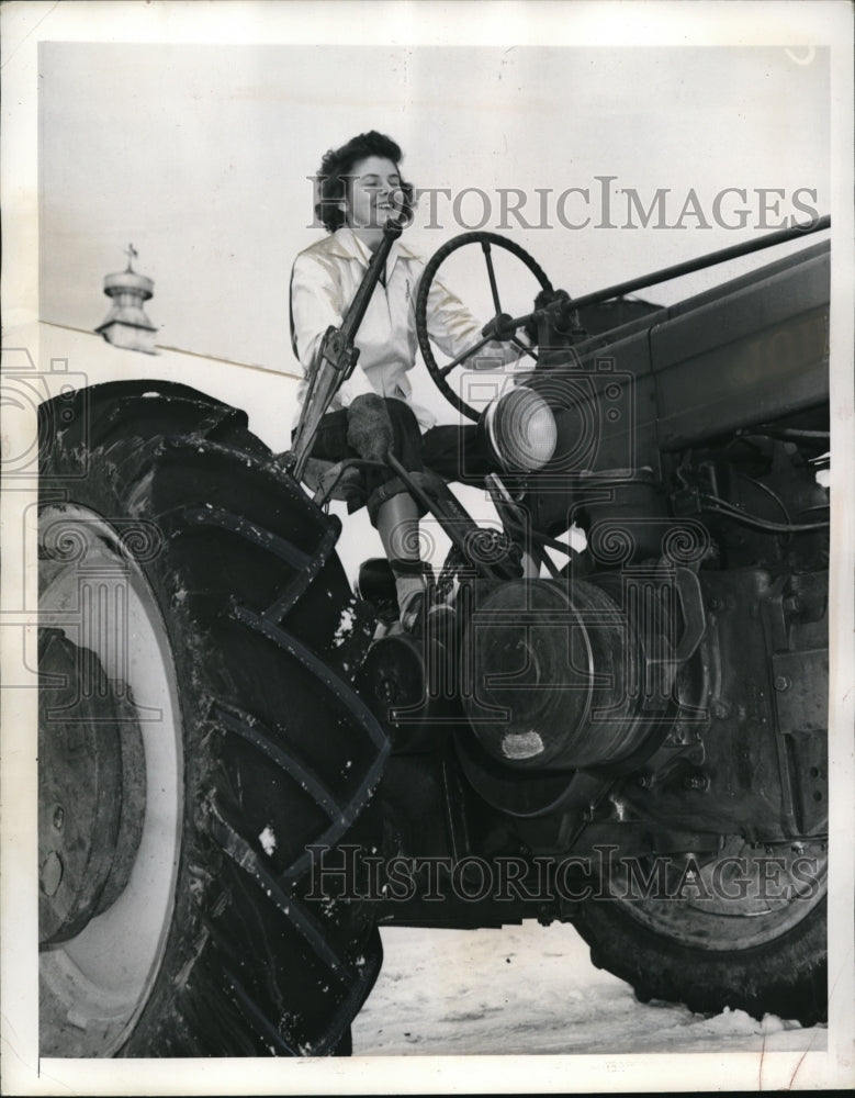 1941 Press Photo Anne Hemenway taking lesson in operating the Farm Tractor.