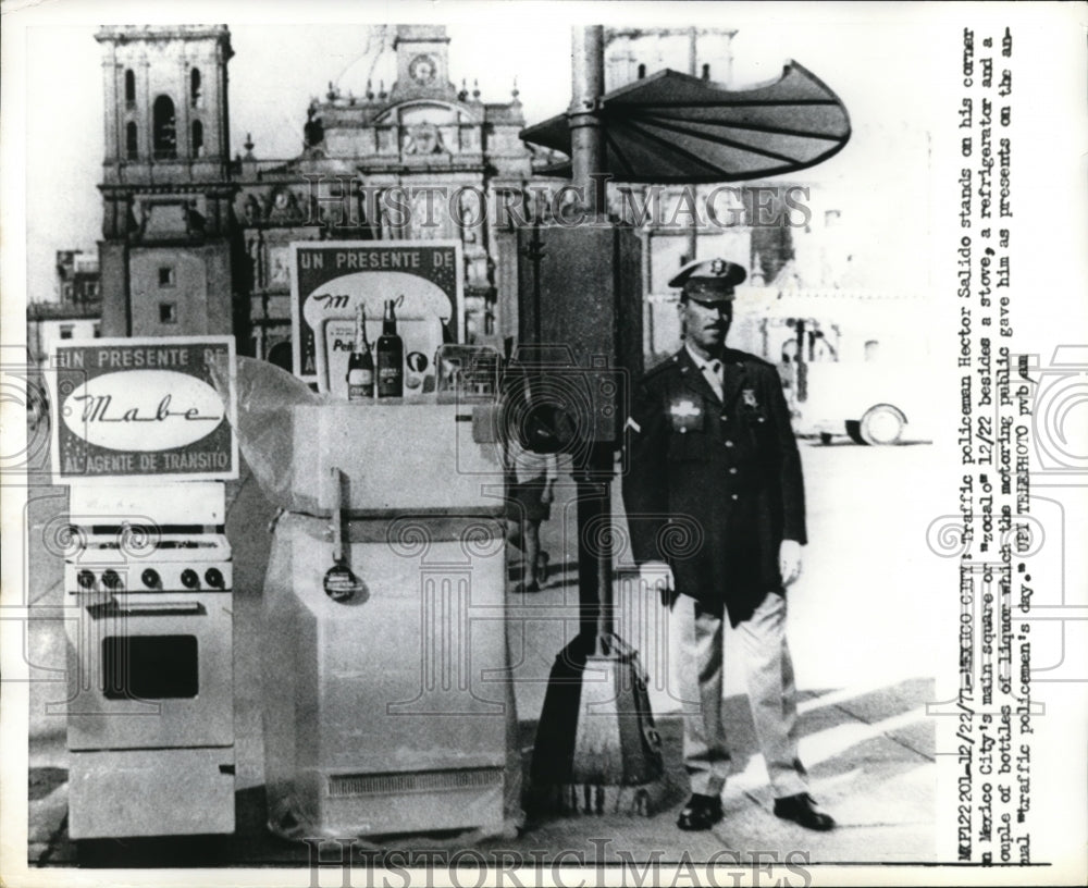 1971 Press Photo Hector Salido Stands Next to Gifts in Zocalo, Mexico City.