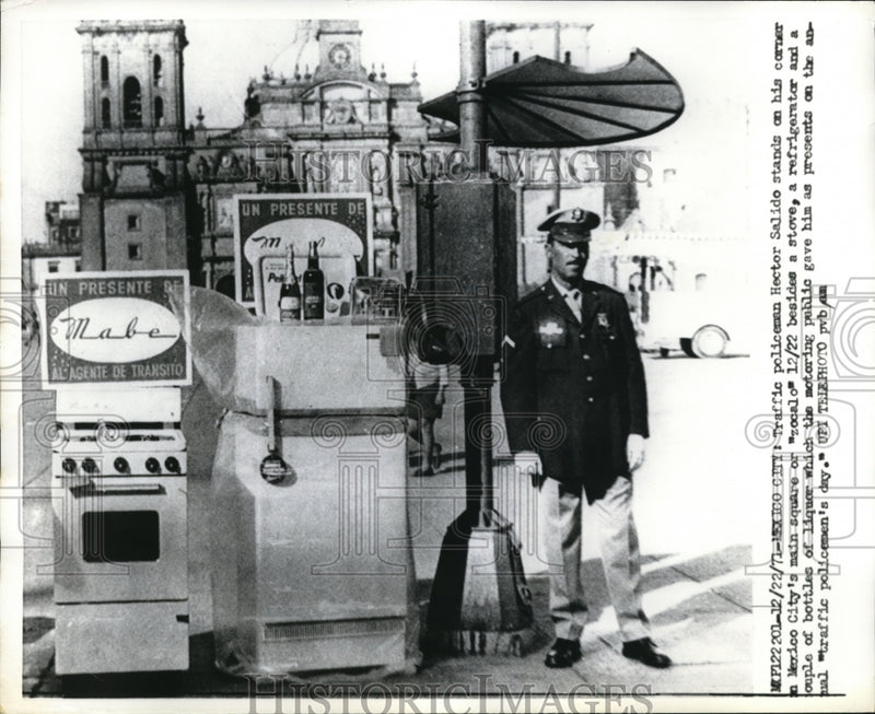 Load image into Gallery viewer, 1971 Press Photo Hector Salido Stands Next to Gifts in Zocalo, Mexico City.
