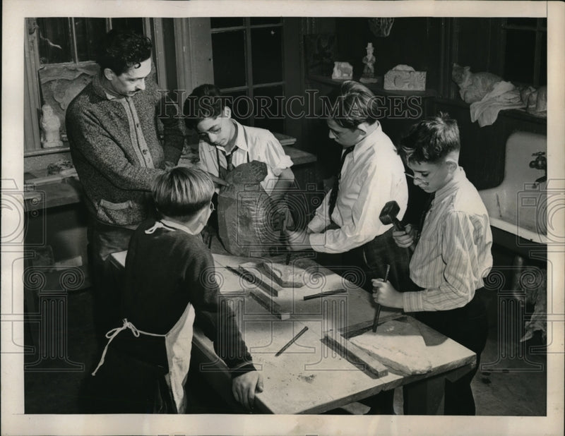 Load image into Gallery viewer, 1940 Press Photo Instructor Criticizes The Work Of One Of The Boys
