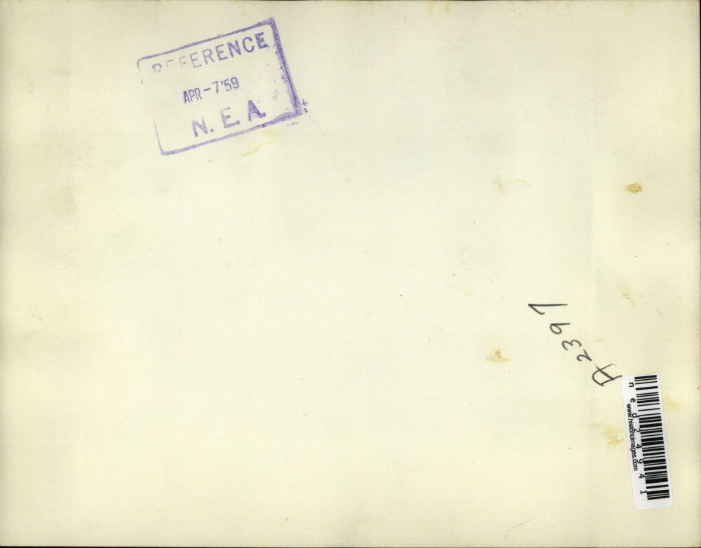 1959 Press Photo Smoke rises from burning timber store during riot at