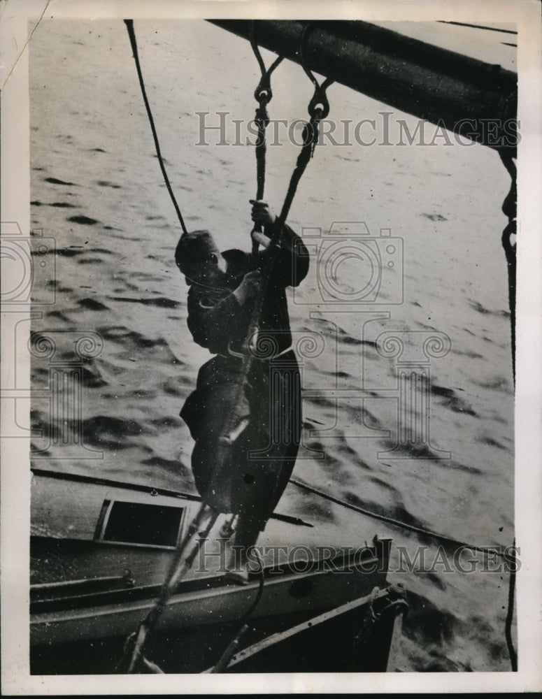 Load image into Gallery viewer, 1936 Press Photo Father Yvon, Climbing Down Rope Ladder off Greenland.
