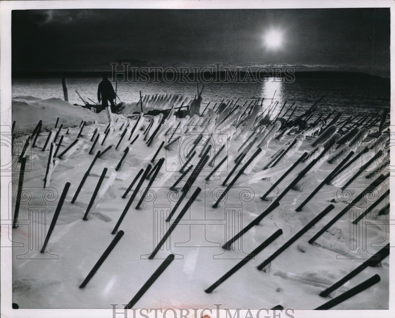 Load image into Gallery viewer, 1955 Press Photo Sunset and Cold Steel rising out of the snow-covered foundation
