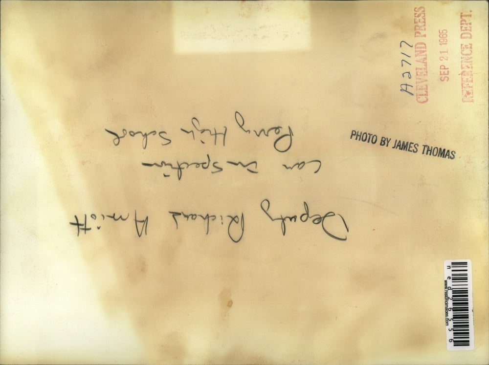 1965 Press Photo Deputy Richard Arniott does car inspection at Perry High School