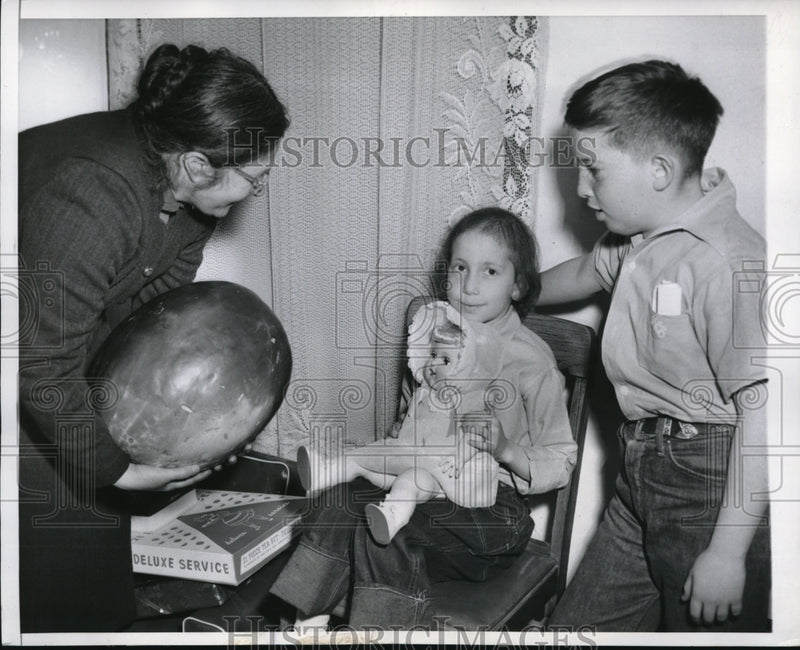 Load image into Gallery viewer, 1952 Press Photo Jeanette Tapia whom has leukemia receives a watermelon.
